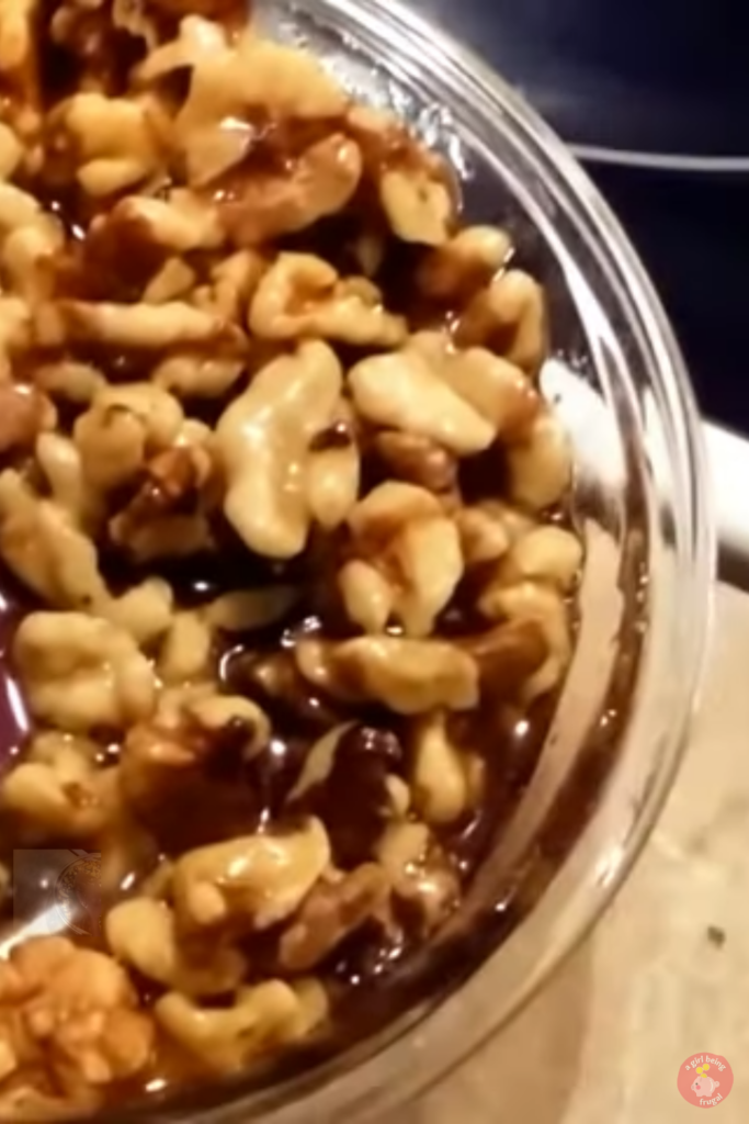Wet walnuts in a glass bowl.
