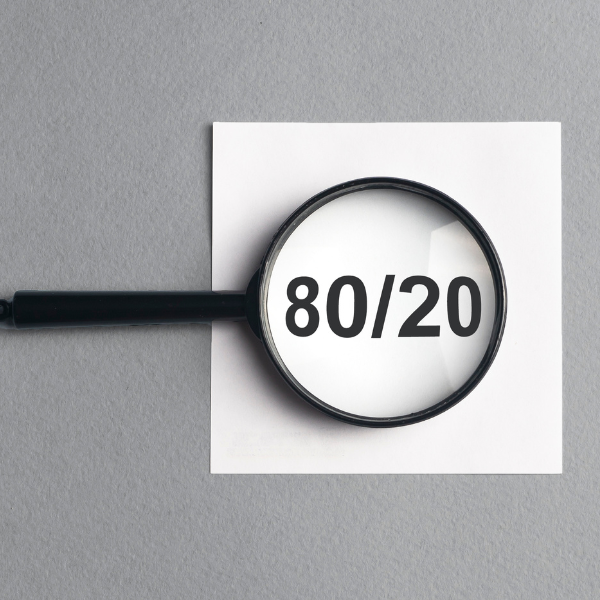 80 20 pareto concept magnified on gray background
